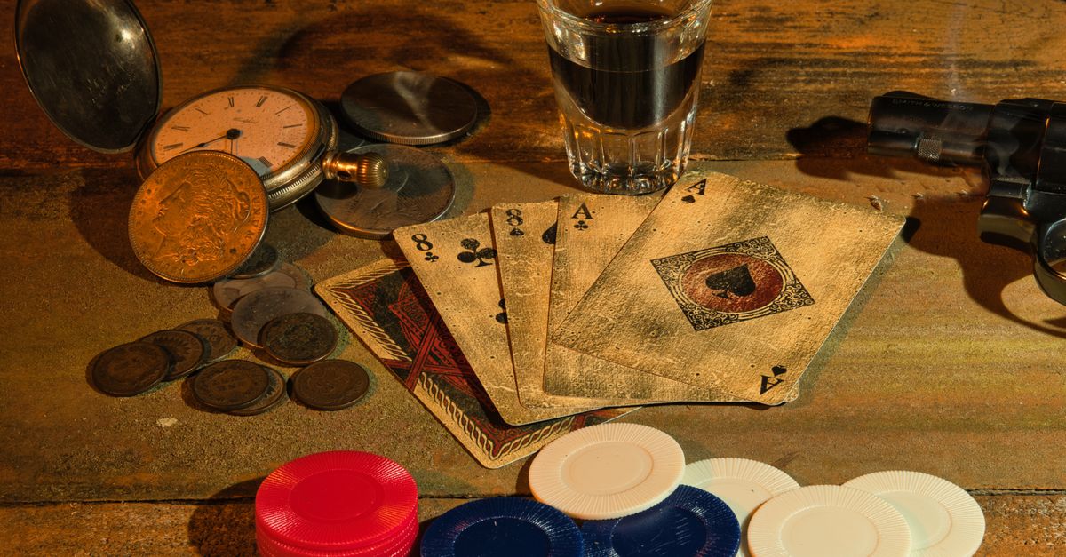 A vintage-themed still life featuring playing cards, poker chips, coins, a revolver, and a pocket watch.